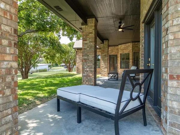a patio with patio couch and table