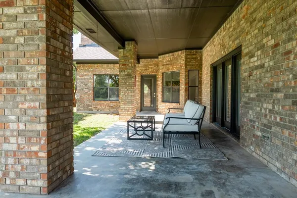 a view of grassy field with benches
