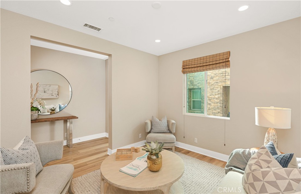 245 Follyhatch Irvine, CA 92618 - Photo 17 of 44 a living room with furniture and a window