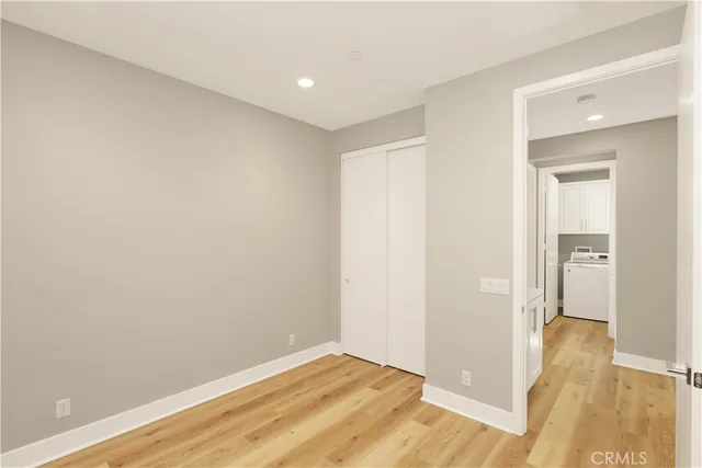 a view of hallway with wooden floor