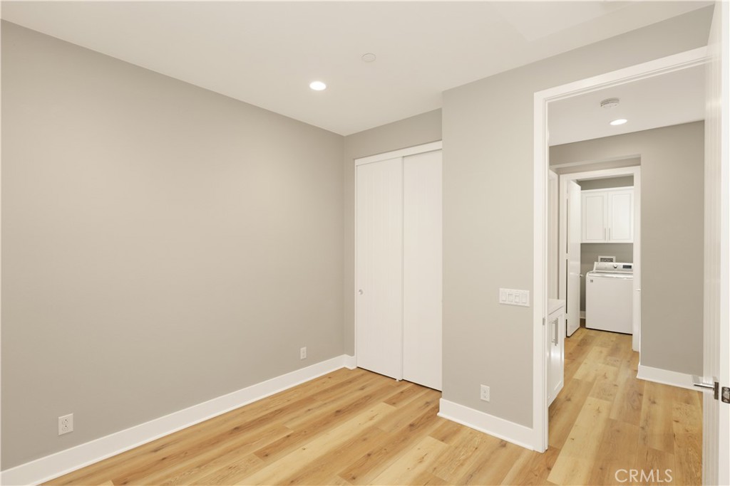 245 Follyhatch Irvine, CA 92618 - Photo 23 of 44 a view of hallway with wooden floor