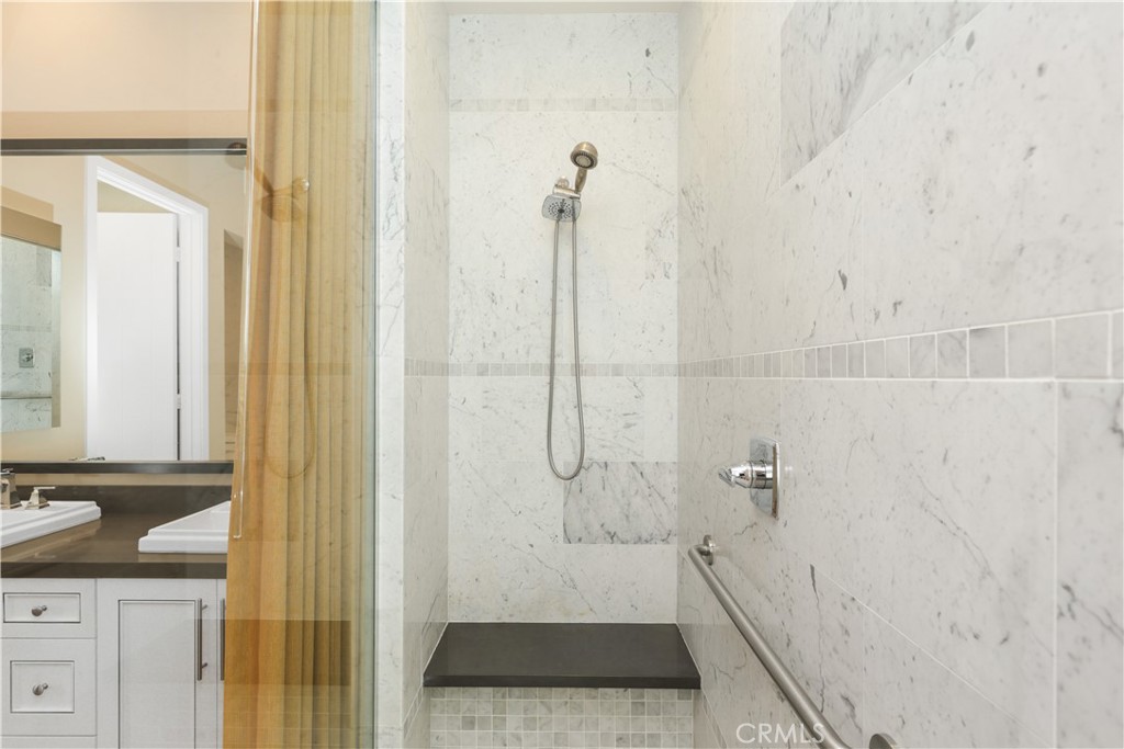 245 Follyhatch Irvine, CA 92618 - Photo 27 of 44 a bathroom with a granite countertop shower