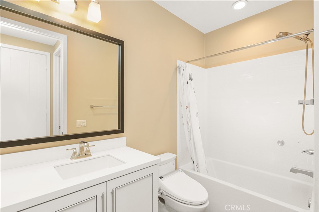 245 Follyhatch Irvine, CA 92618 - Photo 28 of 44 a bathroom with a sink a toilet and shower