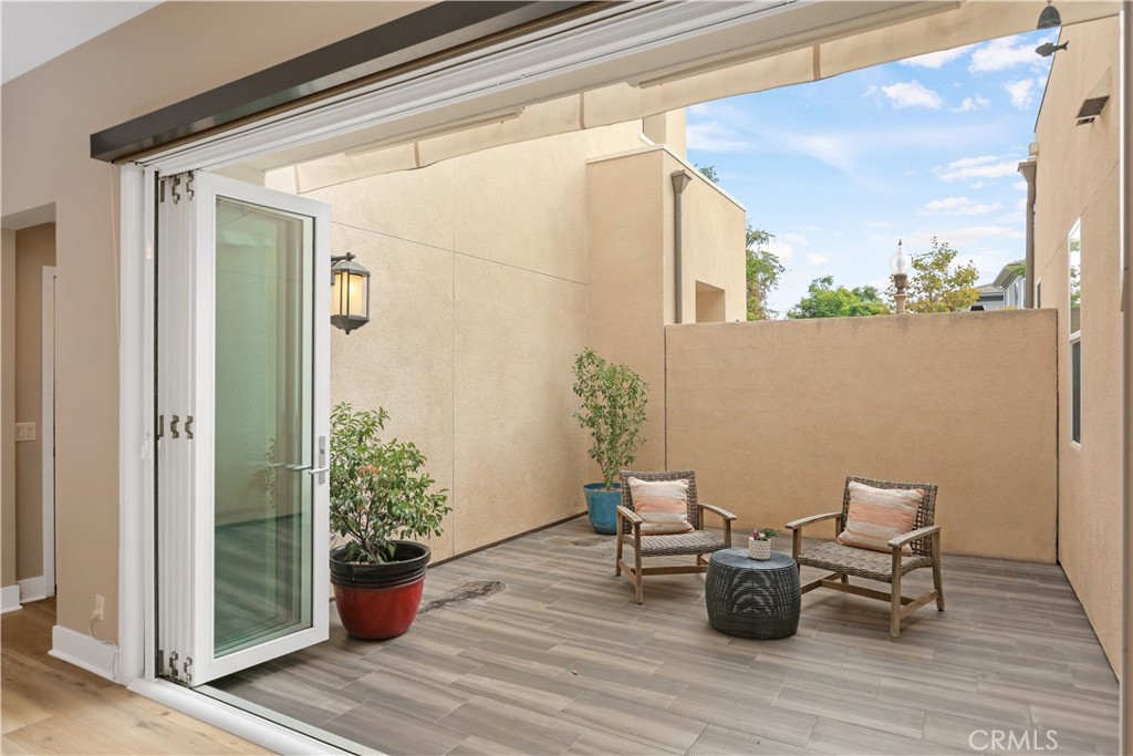 245 Follyhatch Irvine, CA 92618 - Photo 31 of 44 a view of a chair and table in the balcony