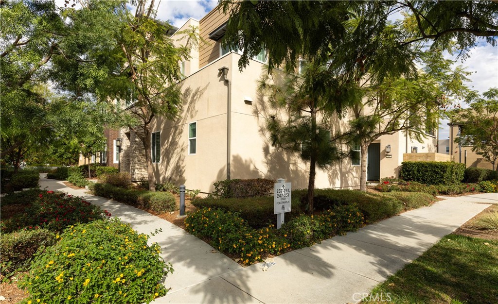 245 Follyhatch Irvine, CA 92618 - Photo 38 of 44 a front view of a house with a yard and tree s