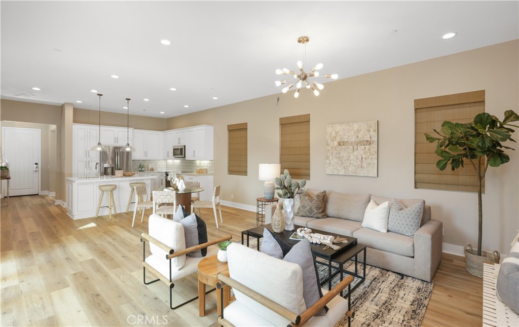 245 Follyhatch Irvine, CA 92618 - Photo 4 of 44 a living room with lots of furniture and a chandelier