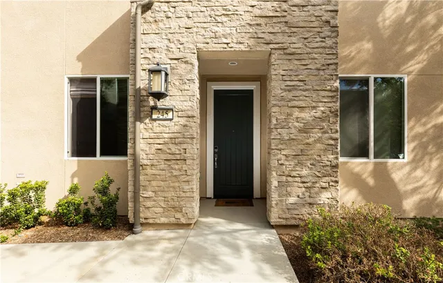 a view of bathroom with a potted plant on the counter and toilet
