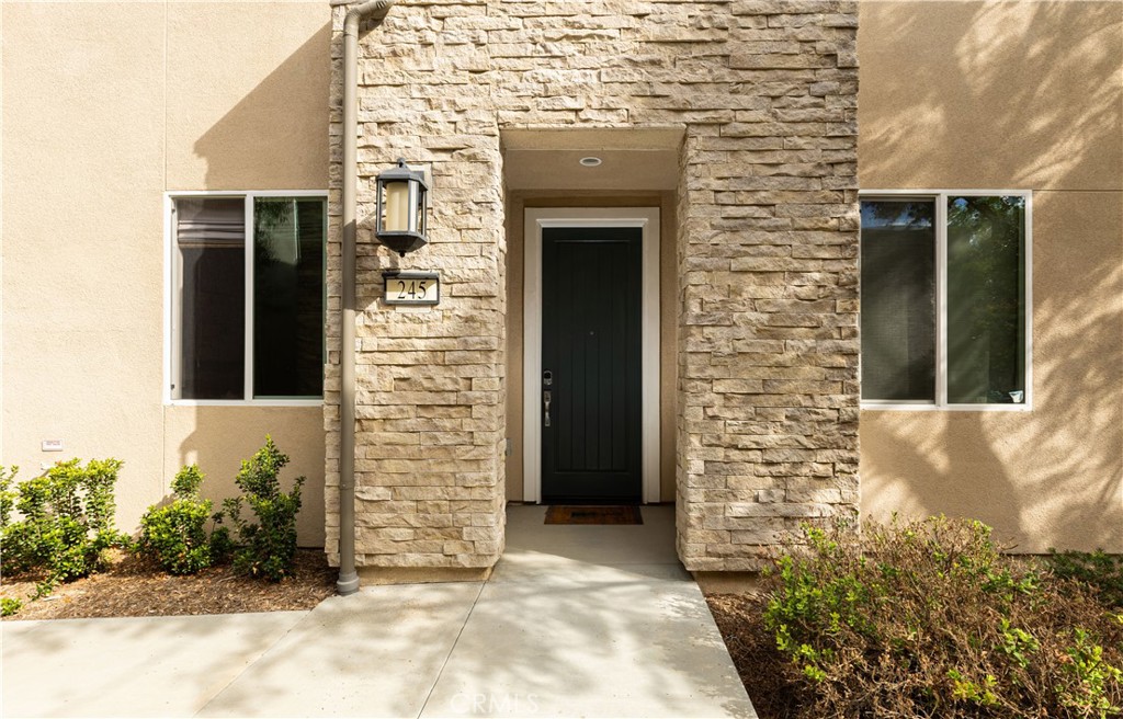 245 Follyhatch Irvine, CA 92618 - Photo 43 of 44 a front view of a house with a yard