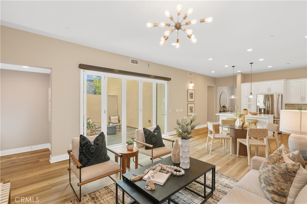245 Follyhatch Irvine, CA 92618 - Photo 5 of 44 a living room with furniture and a large window