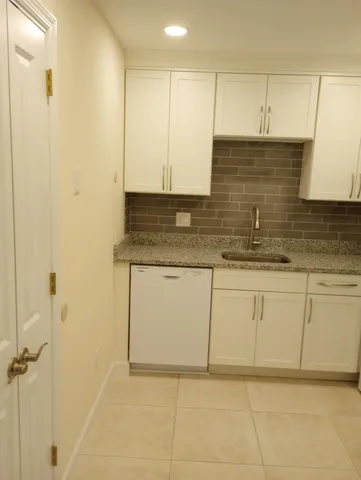 a bathroom with a sink a vanity and a mirror