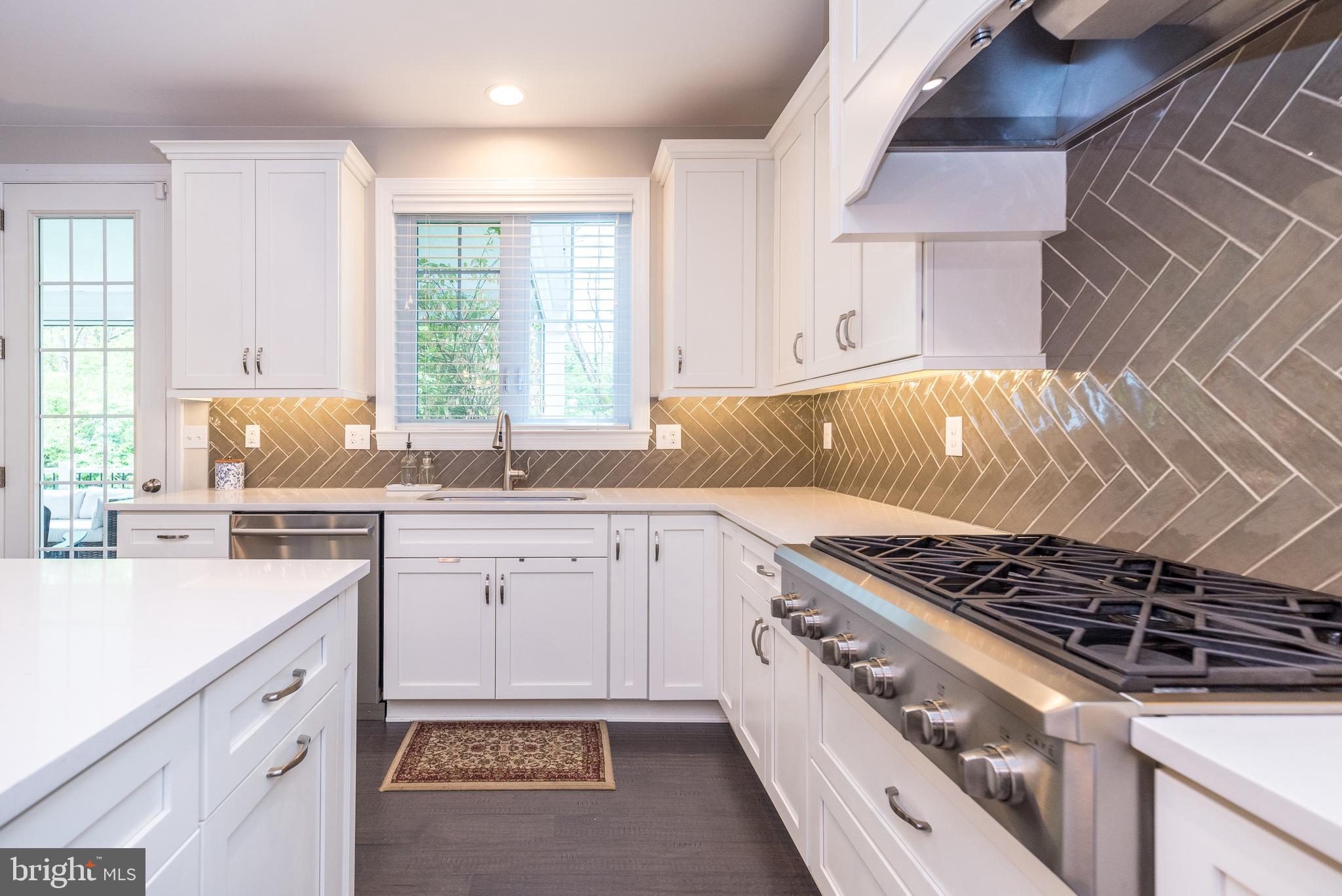 1 White Field Lower Gwynedd, PA 19002 - Photo 15 of 53 a kitchen with granite countertop a sink stove and cabinets