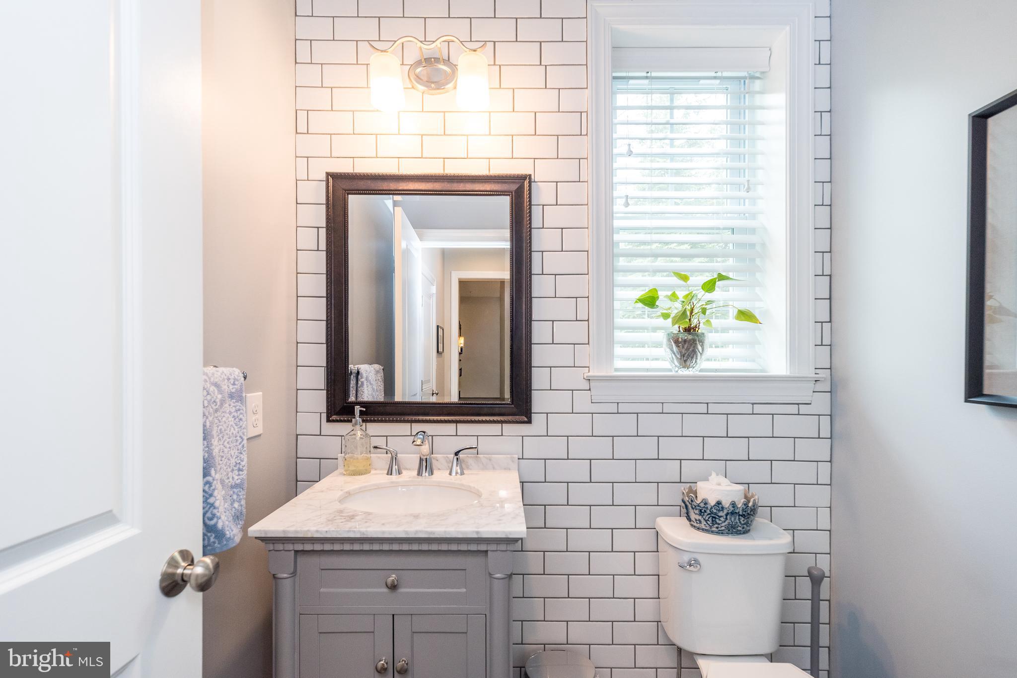 1 White Field Lower Gwynedd, PA 19002 - Photo 21 of 53 a bathroom with a toilet sink and mirror