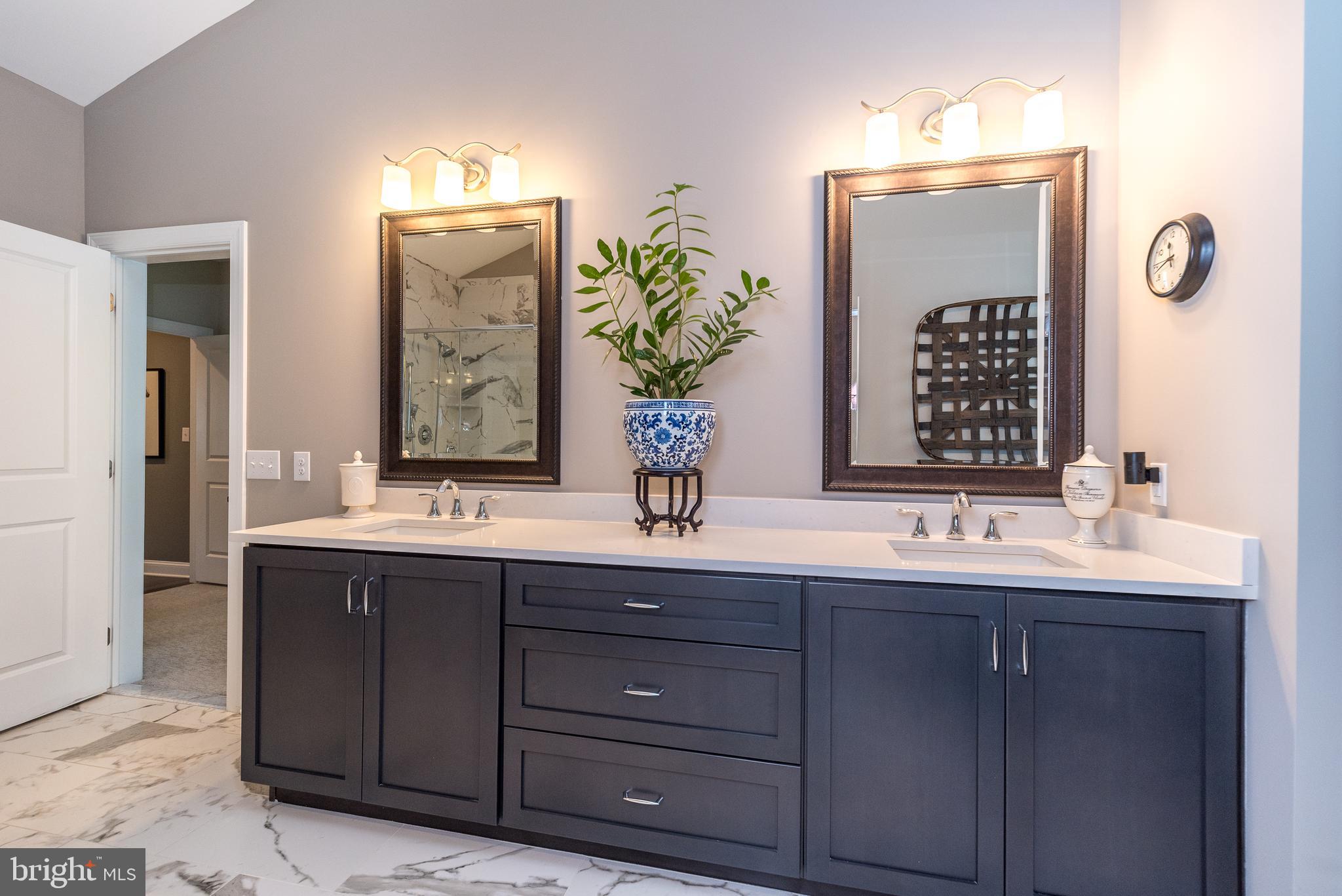1 White Field Lower Gwynedd, PA 19002 - Photo 29 of 53 a bathroom with a double vanity sink and a mirror