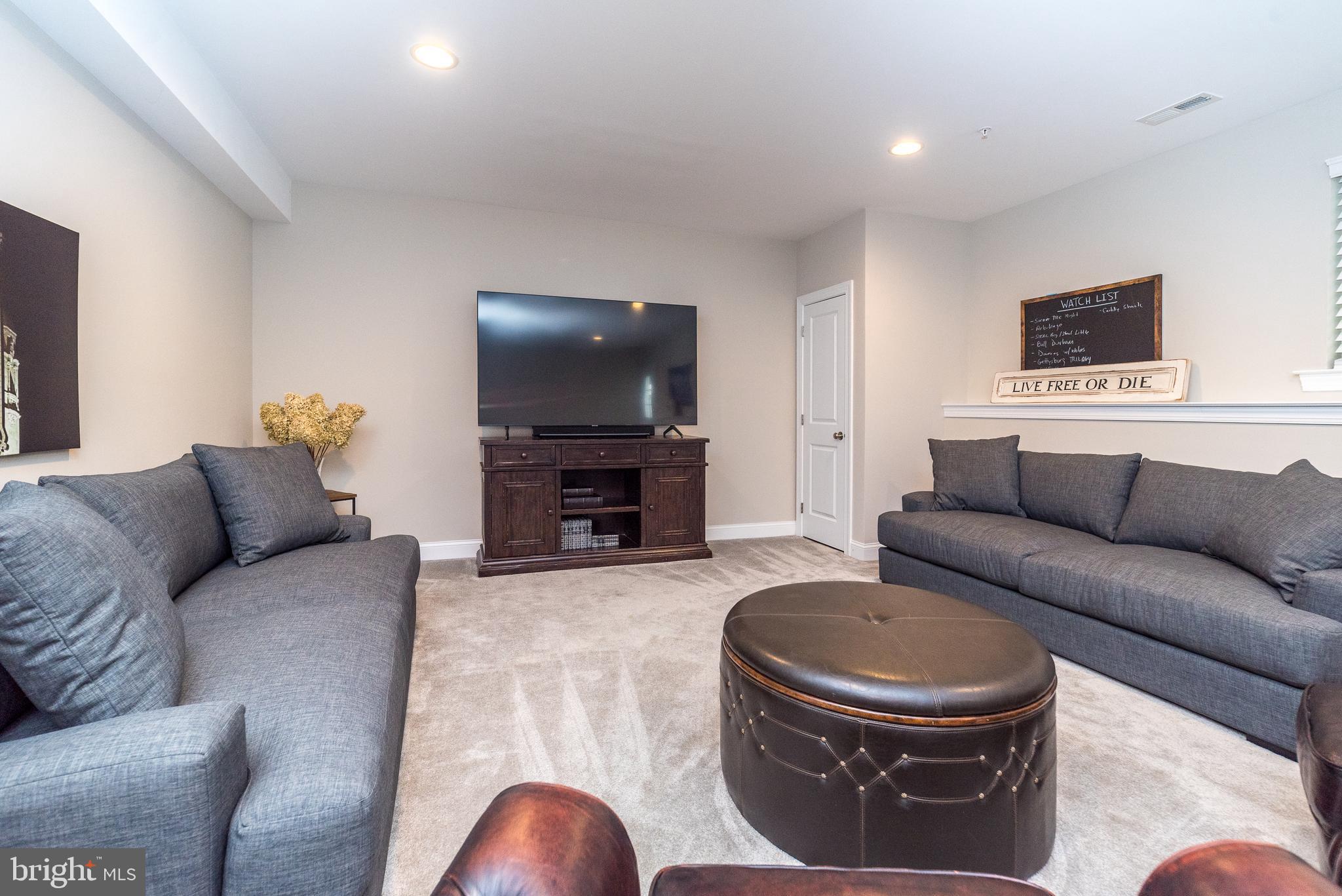 1 White Field Lower Gwynedd, PA 19002 - Photo 39 of 53 a living room with furniture and a flat screen tv