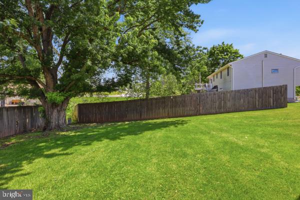 3496 Fox Ridge Court Dover, PA 17315 - Photo 27 of 35 a view of a backyard with potted plants and wooden fence