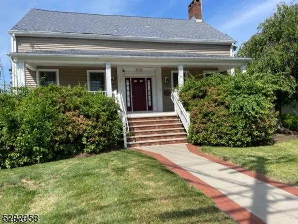 a view of a house with potted plants