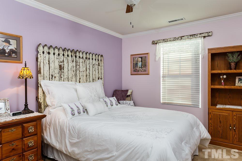 131 Daneborg Road Durham, NC 27703 - Photo 19 of 25 Each upstairs bedroom has a large closet, ceiling fan, and plenty of room for a queen bed or twins.