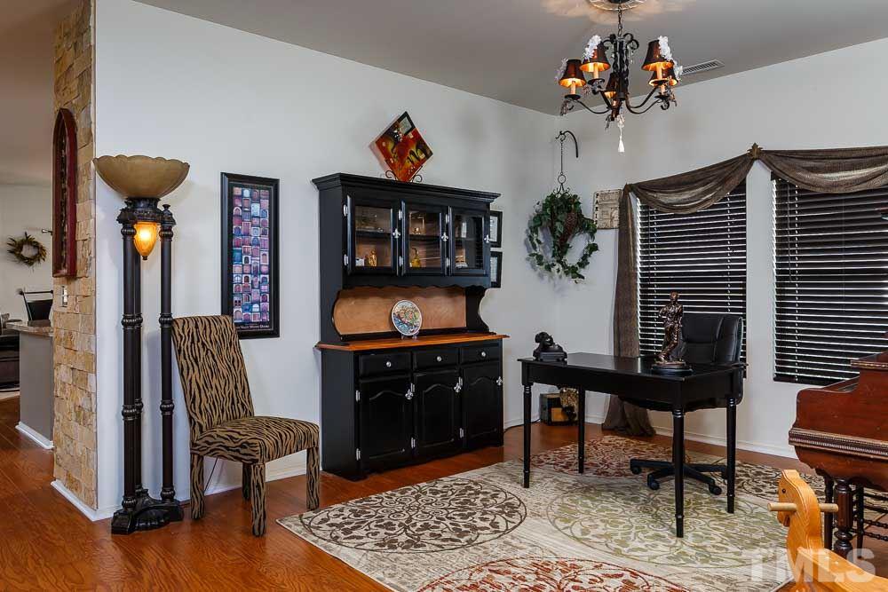 131 Daneborg Road Durham, NC 27703 - Photo 3 of 25 Step onto the expansive hardwoods with your first stop in the spacious formal dining room, currently used as a home office.
