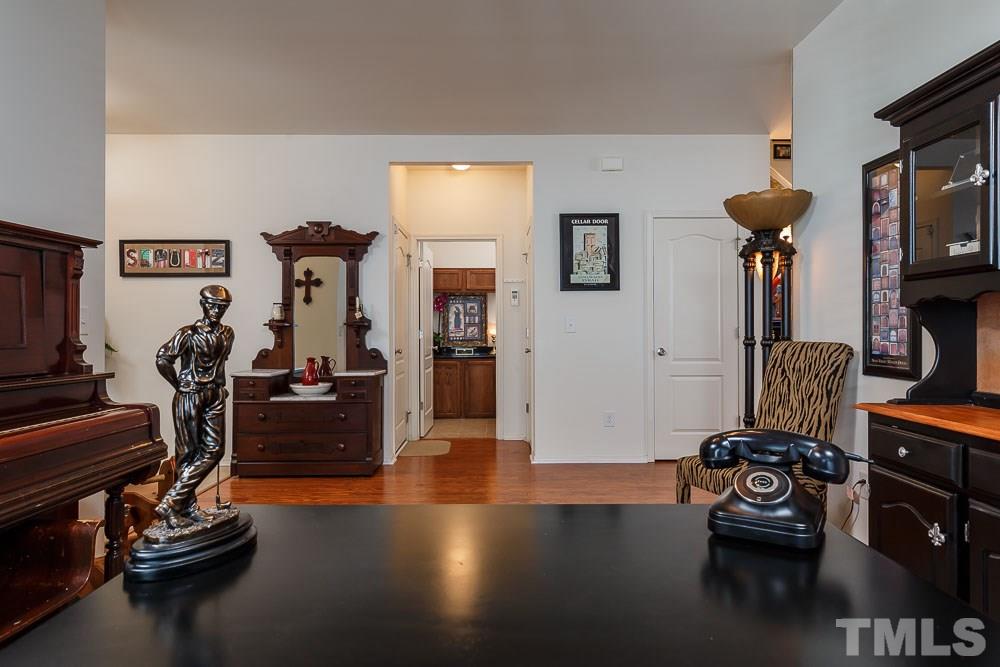 131 Daneborg Road Durham, NC 27703 - Photo 4 of 25 This angle reflects the garage entry and laundry straight ahead. To the left is the front door with the powder room tucked privately down a short hall. To the right, of course, is the great room and kitchen.