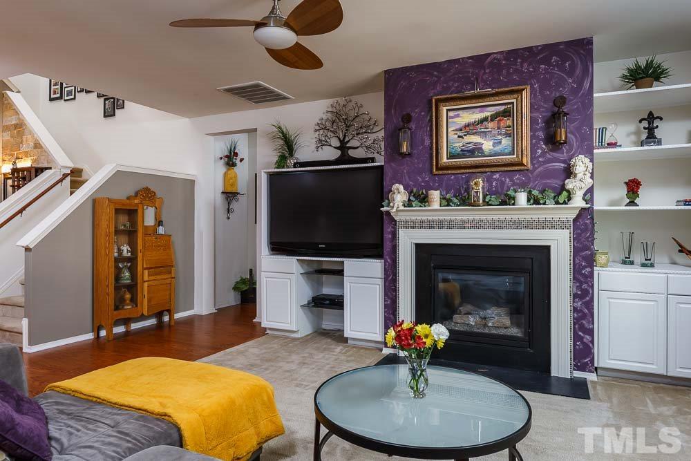 131 Daneborg Road Durham, NC 27703 - Photo 10 of 25 Cozy up to the custom tiled fireplace on an intimate winter evening, or entertain a crowd for the big game with seating for everyone without leaving the chef alone in the kitchen!