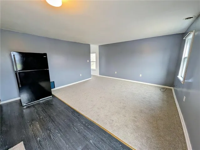 a bathroom with a sink a toilet a mirror and shower