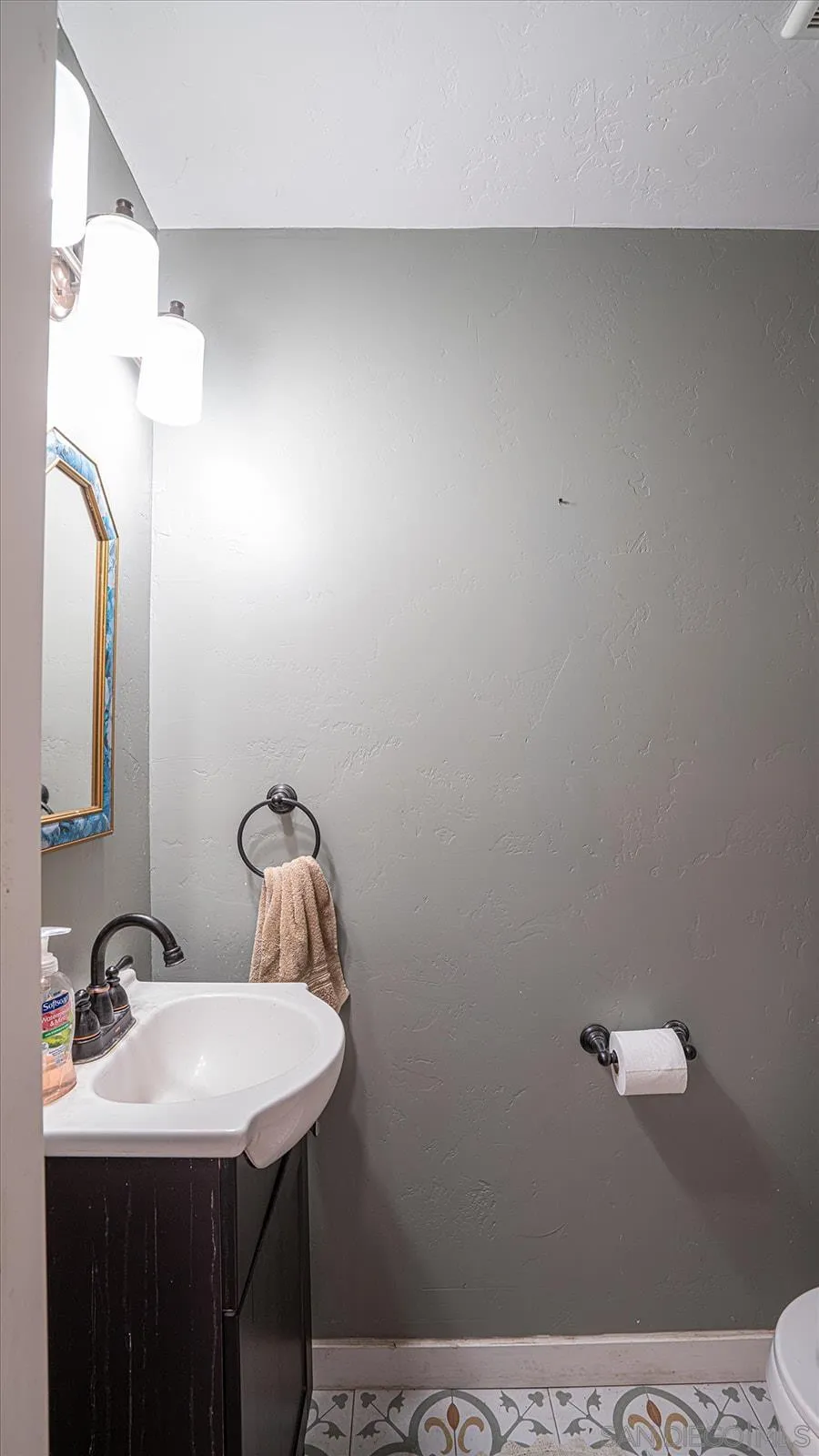 5451 Redding Road San Diego, CA 92115 - Photo 16 of 37 a bathroom with a sink vanity and a mirror