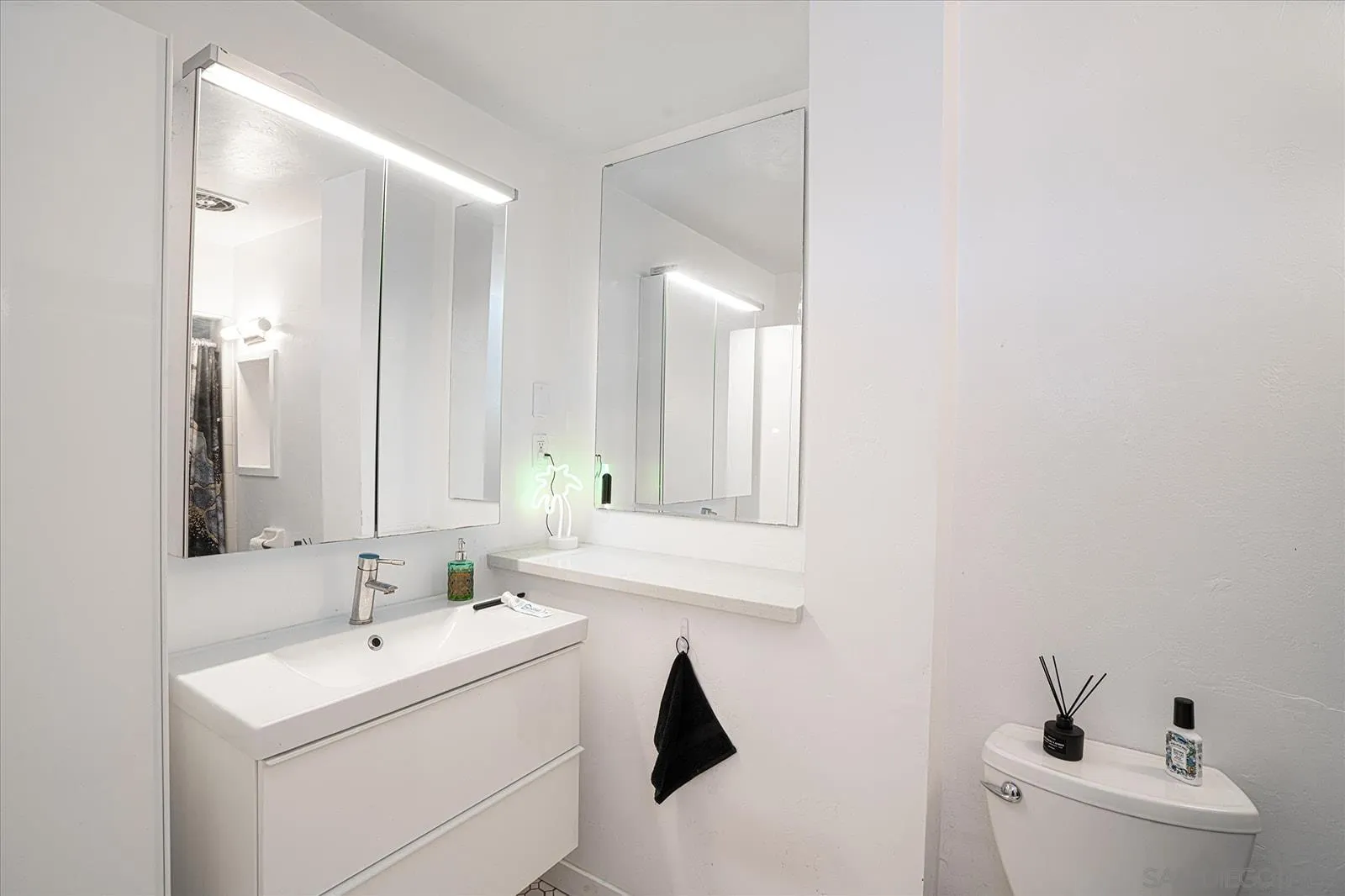 5451 Redding Road San Diego, CA 92115 - Photo 20 of 37 a bathroom with a sink and a mirror