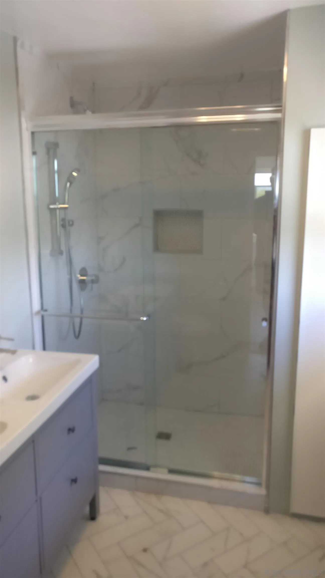 5451 Redding Road San Diego, CA 92115 - Photo 21 of 37 a bathroom with a shower and a sink