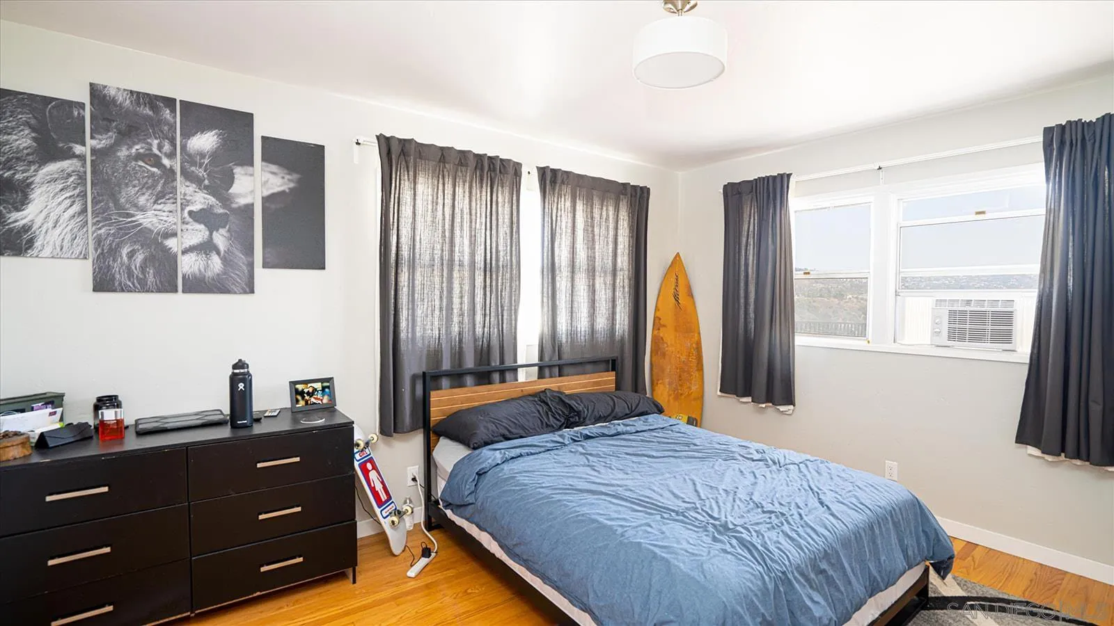 5451 Redding Road San Diego, CA 92115 - Photo 22 of 37 a bed room with a bed and a window