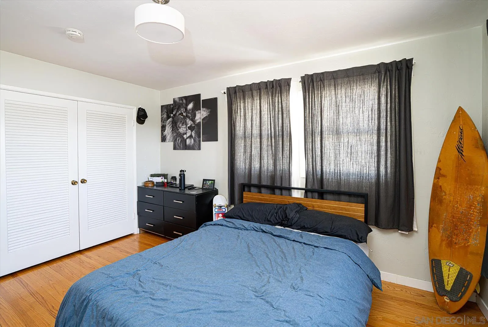 5451 Redding Road San Diego, CA 92115 - Photo 23 of 37 a bedroom with a bed and a dresser