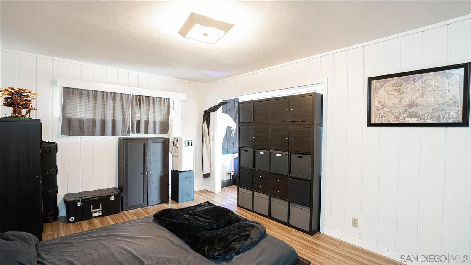 5451 Redding Road San Diego, CA 92115 - Photo 30 of 37 a bedroom with a bed and a refrigerator