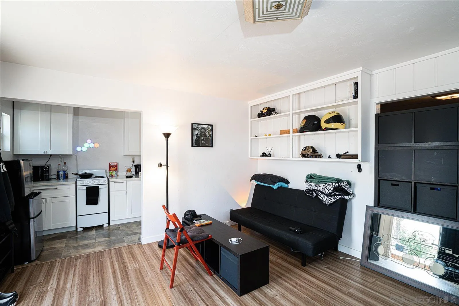 5451 Redding Road San Diego, CA 92115 - Photo 33 of 37 a living room with furniture and wooden floor