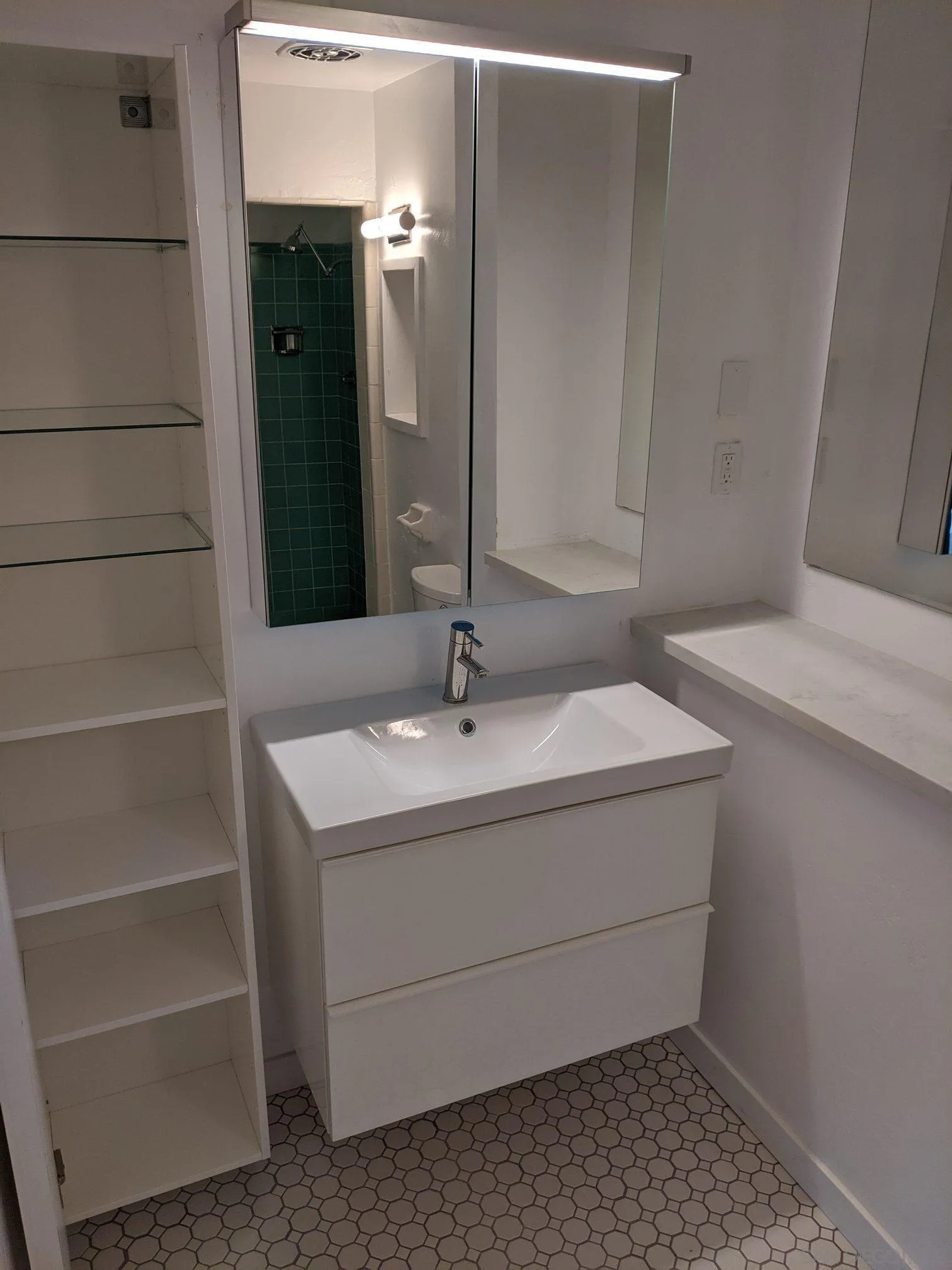 5451 Redding Road San Diego, CA 92115 - Photo 36 of 37 a bathroom with a sink and a mirror