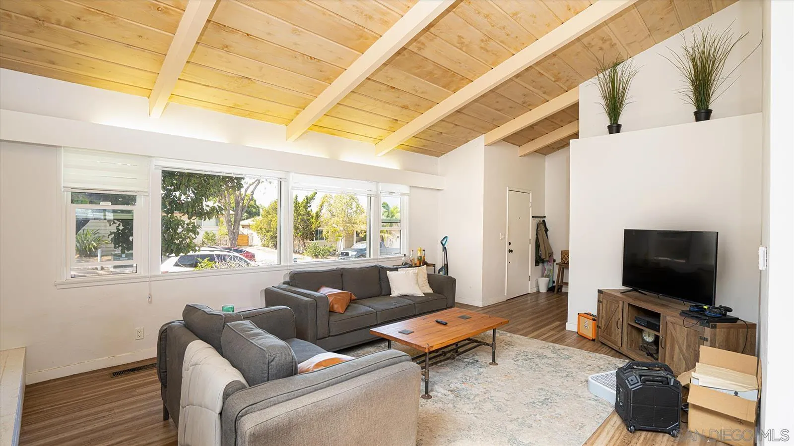 5451 Redding Road San Diego, CA 92115 - Photo 4 of 37 a living room with furniture and a flat screen tv