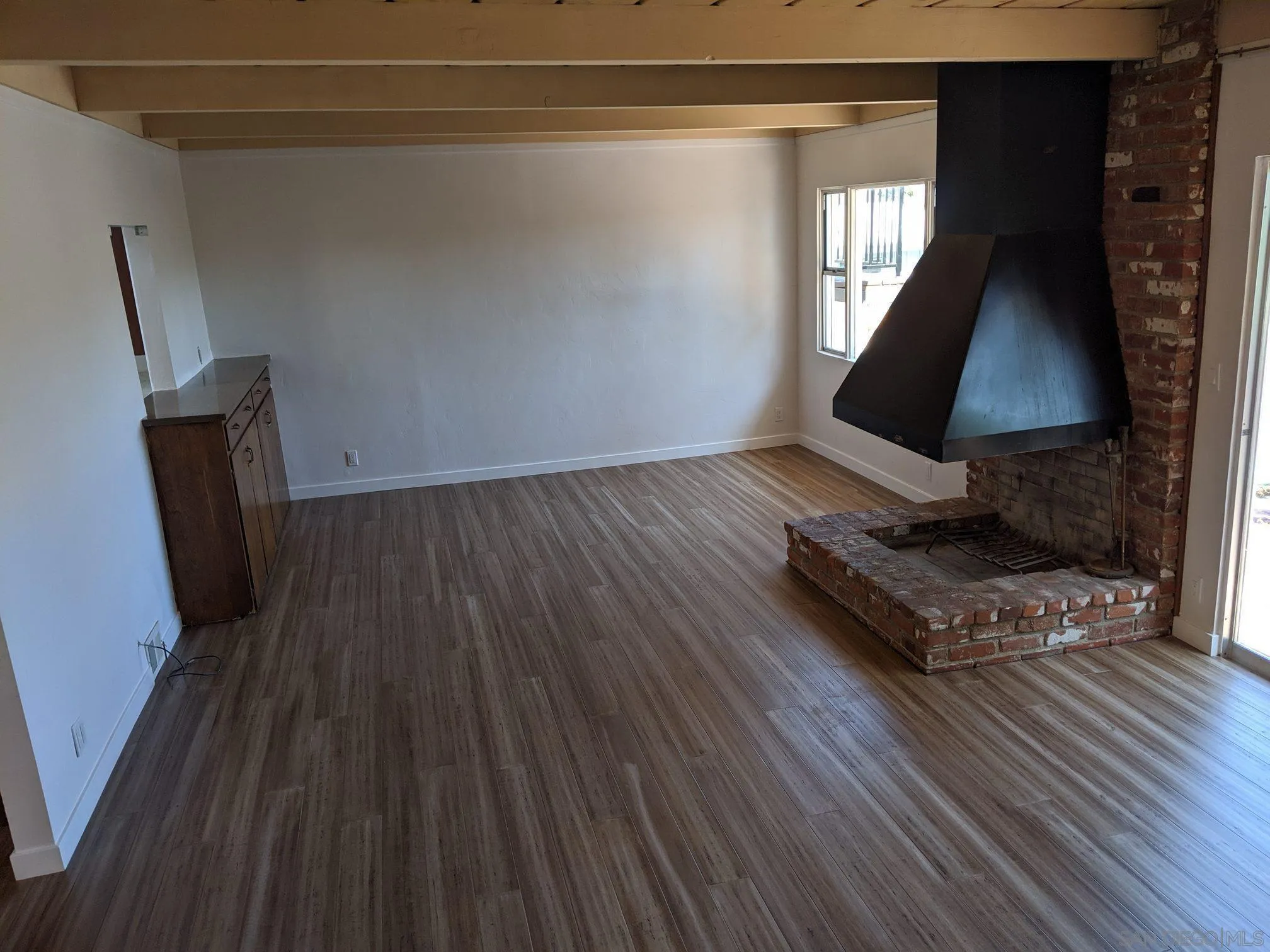 5451 Redding Road San Diego, CA 92115 - Photo 7 of 37 a living room with wooden floor and large window