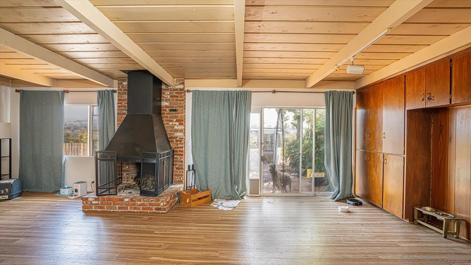 5451 Redding Road San Diego, CA 92115 - Photo 8 of 37 a view of a livingroom with wooden floor and a fireplace