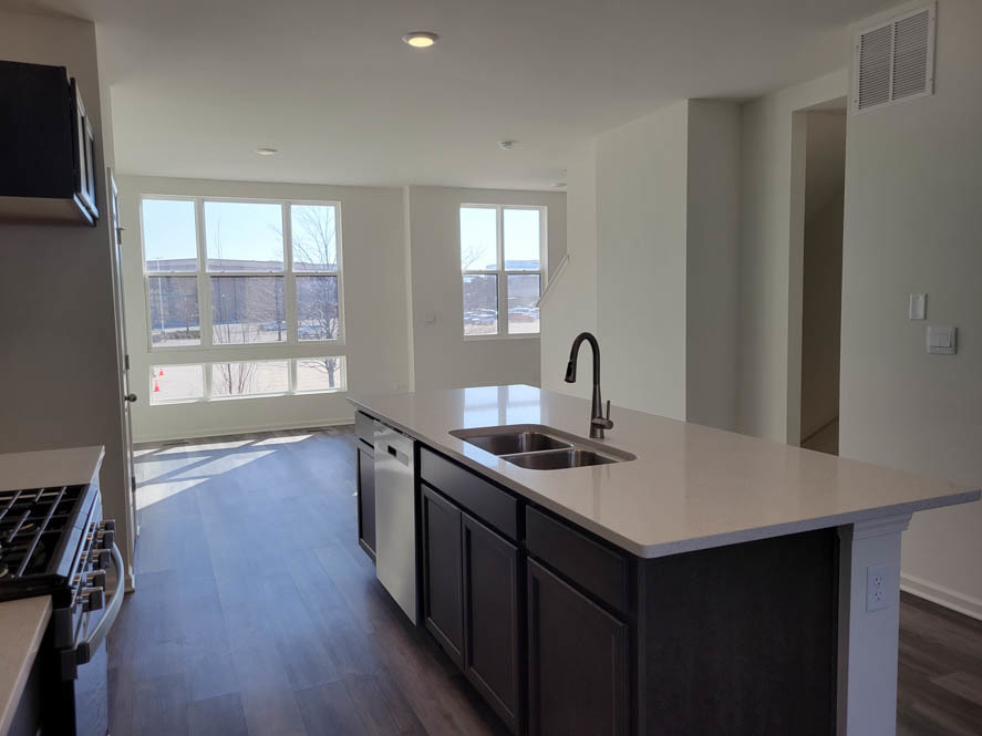 358 Summit Circle Lombard, IL 60148 - Photo 21 of 55 a kitchen with sink cabinets and wooden floor