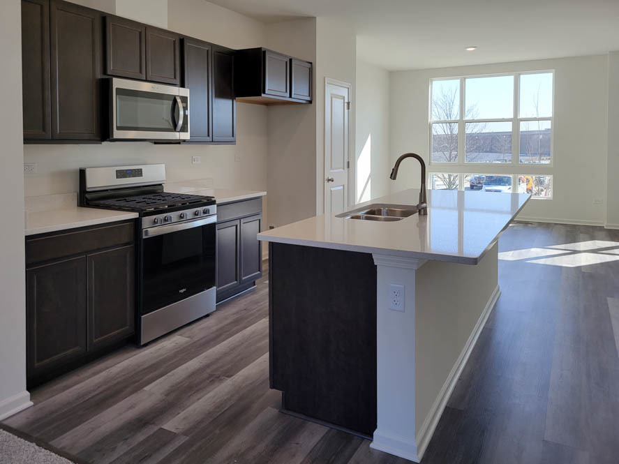 358 Summit Circle Lombard, IL 60148 - Photo 23 of 55 a kitchen with stainless steel appliances granite countertop a stove a sink and a microwave