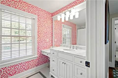 a white bath tub sitting next to a white toilet and a shower curtain
