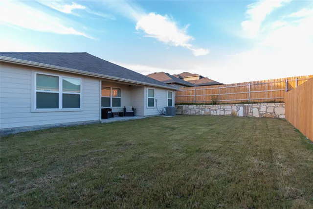 a view of a house with a back yard