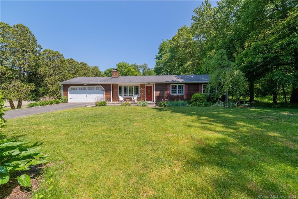 a view of a house with a big yard