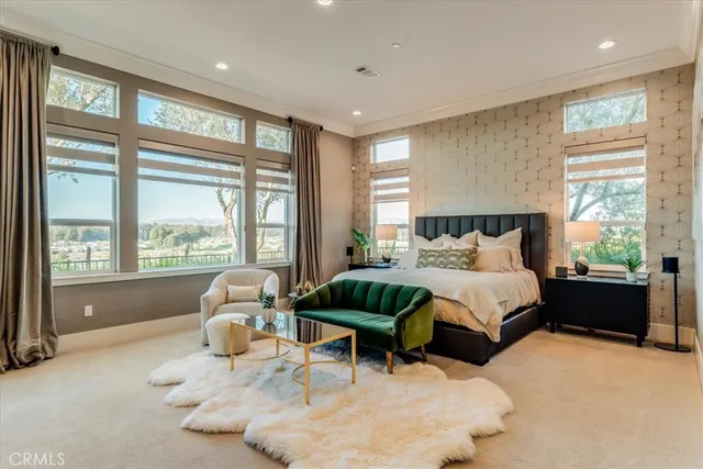 a spacious bathroom with a tub sink and mirror