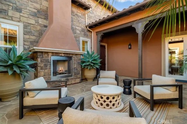 a view of a patio with table and chairs