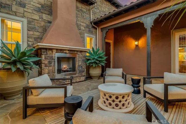 a view of a house with backyard and sitting area