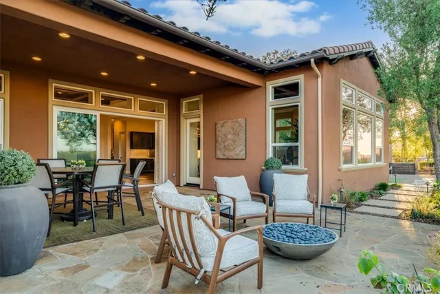 an aerial view of residential house with outdoor space and seating