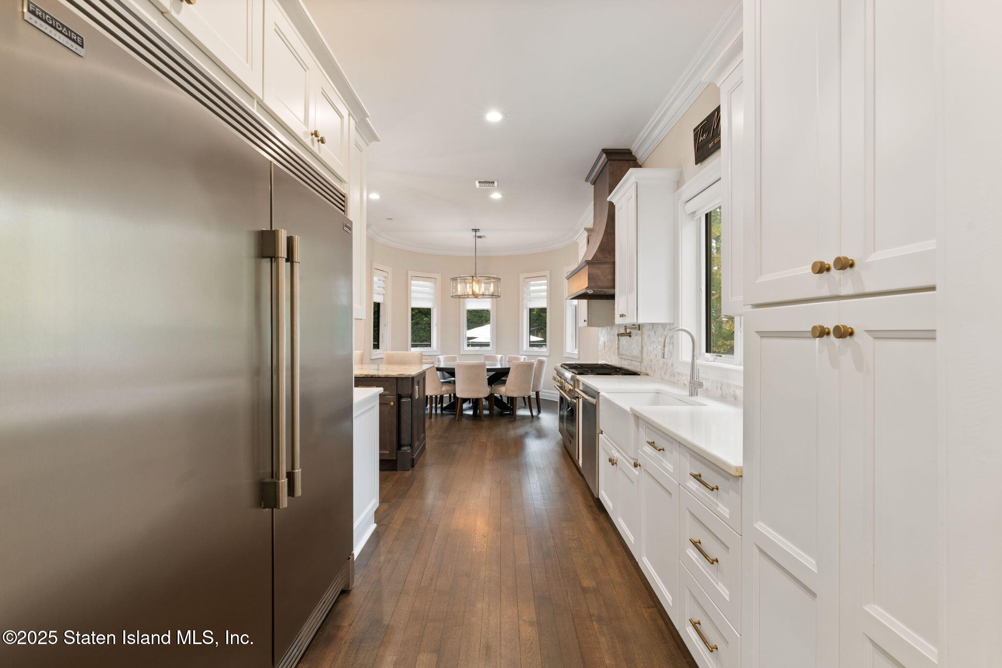 312 London Road Staten Island, NY 10306 - Photo 24 of 82 a kitchen with refrigerator and cabinets