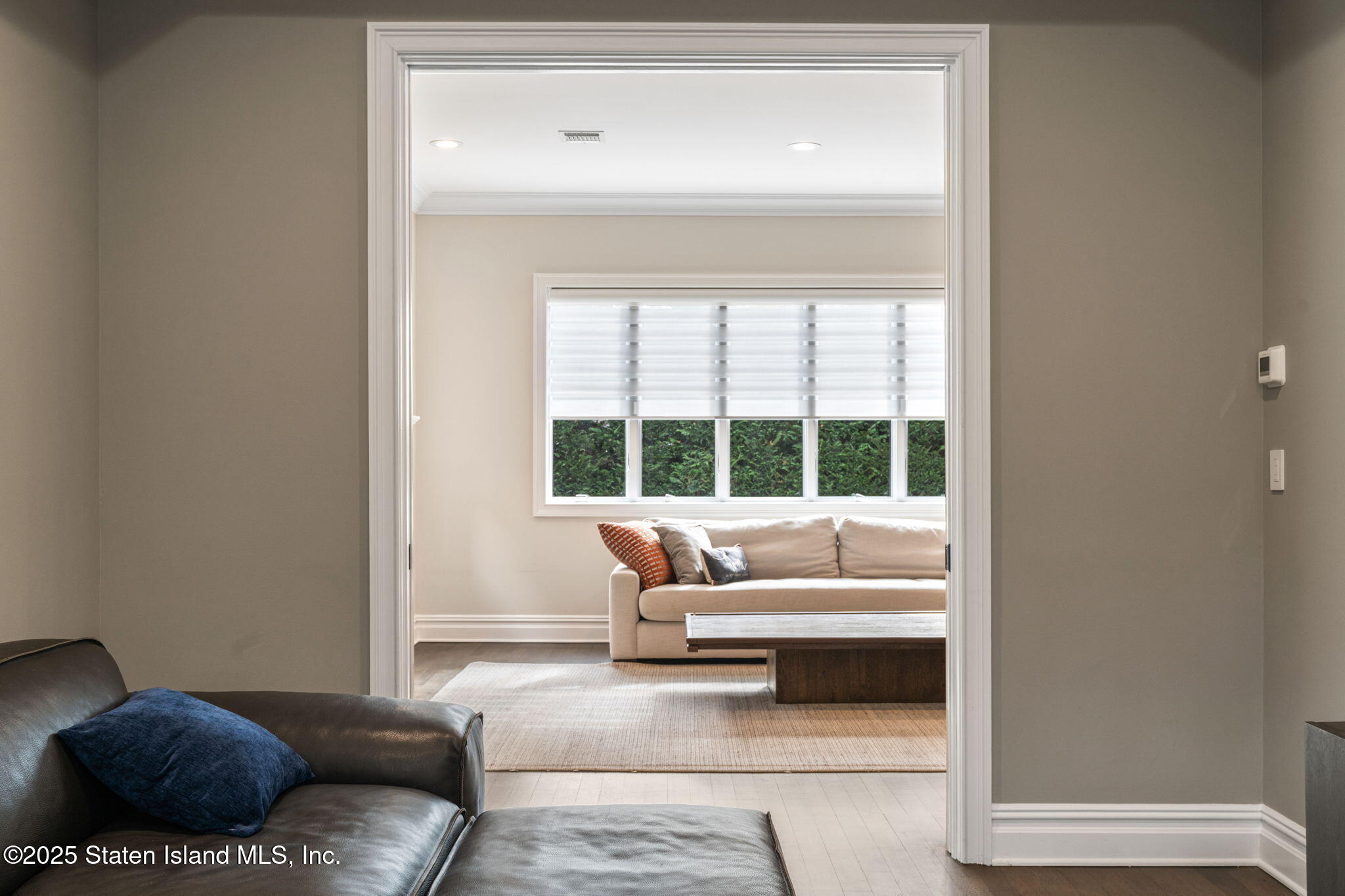 312 London Road Staten Island, NY 10306 - Photo 29 of 82 a living room with furniture and a large window