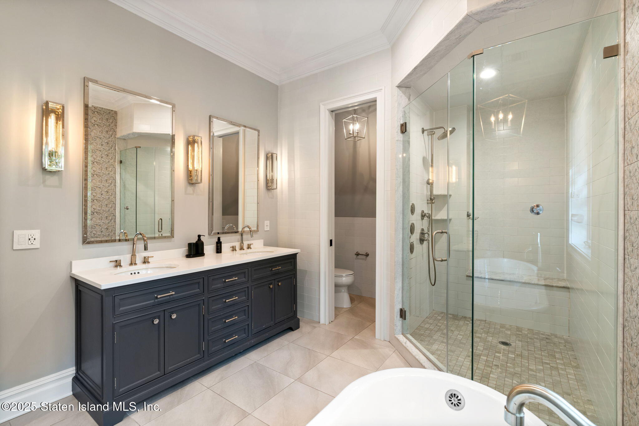 312 London Road Staten Island, NY 10306 - Photo 42 of 82 a bathroom with a sink double vanity and shower