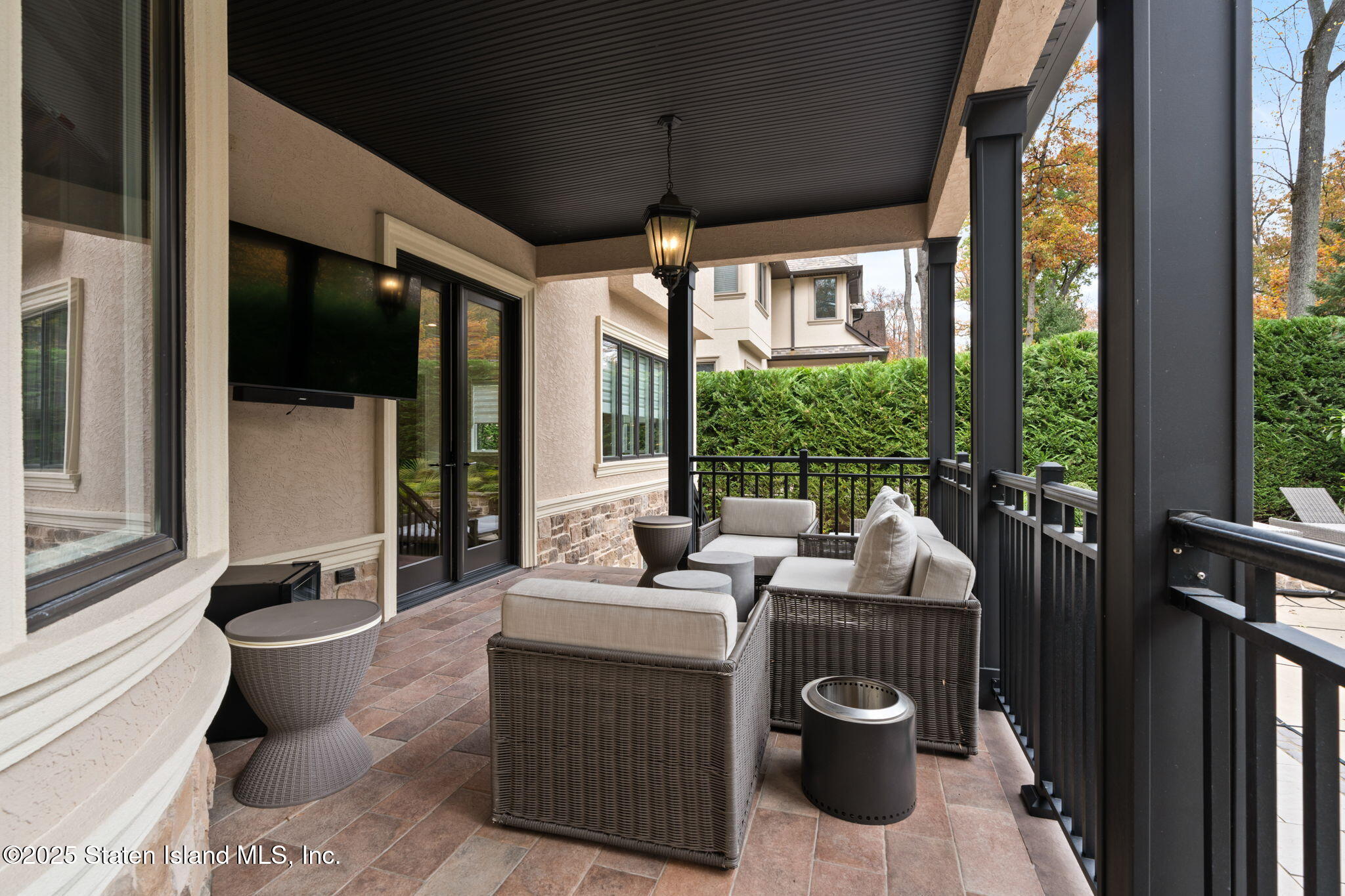 312 London Road Staten Island, NY 10306 - Photo 70 of 82 a living room with furniture and a floor to ceiling window