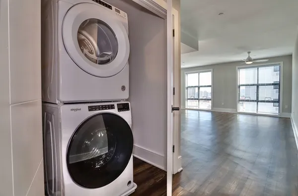 a view of a hallway with washer and dryer
